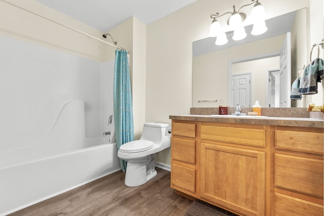 full bathroom featuring wood finished floors, toilet, shower / tub combo with curtain, and vanity