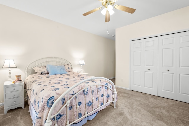 bedroom featuring carpet flooring, a closet, baseboards, and a ceiling fan
