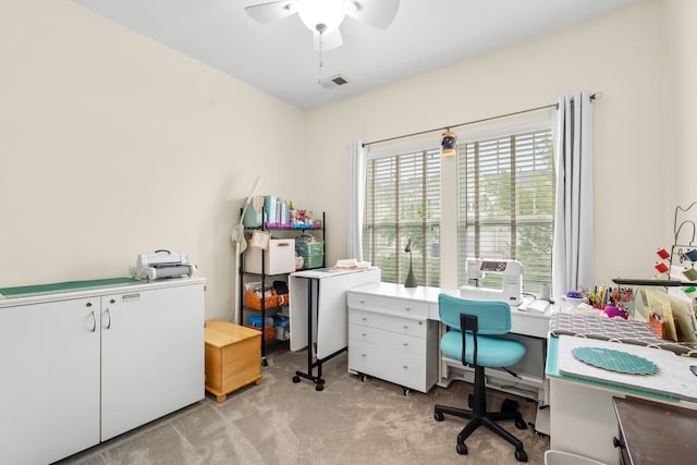 office space featuring light colored carpet and ceiling fan