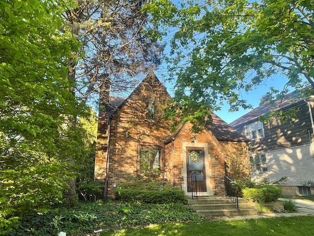 532 Saint Clair St, Grosse Pointe, MI 48230 - tudor-style house featuring a chimney