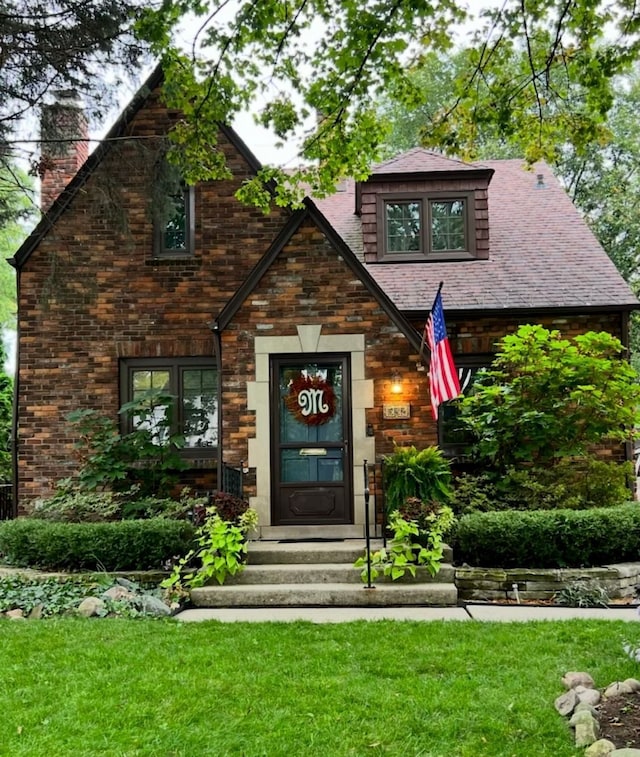 532 Saint Clair St, Grosse Pointe, MI 48230 - view of front of property with a chimney and a front lawn