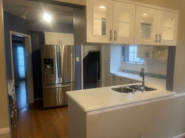 532 Saint Clair St, Grosse Pointe, MI 48230 - kitchen with stainless steel fridge, a sink, white cabinets, glass insert cabinets, and a peninsula