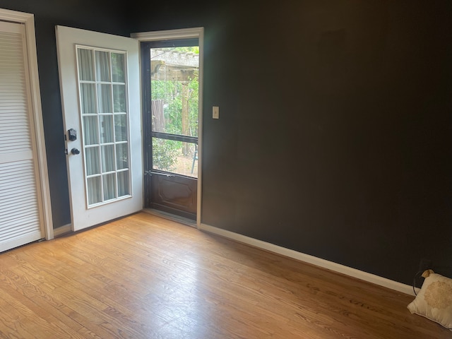 532 Saint Clair St, Grosse Pointe, MI 48230 - doorway to outside featuring light wood-type flooring, baseboards, and plenty of natural light