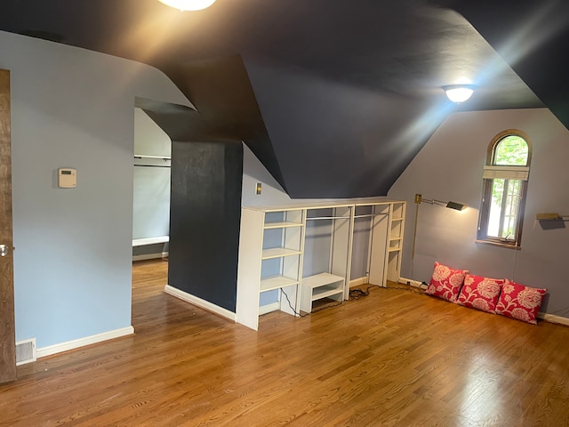 532 Saint Clair St, Grosse Pointe, MI 48230 - additional living space with vaulted ceiling, wood finished floors, and baseboards
