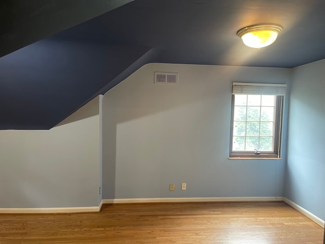 532 Saint Clair St, Grosse Pointe, MI 48230 - additional living space featuring vaulted ceiling, light wood-type flooring, and baseboards