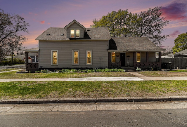 601 N Rath Ave, Ludington, MI 49431 - view of front of house featuring covered porch