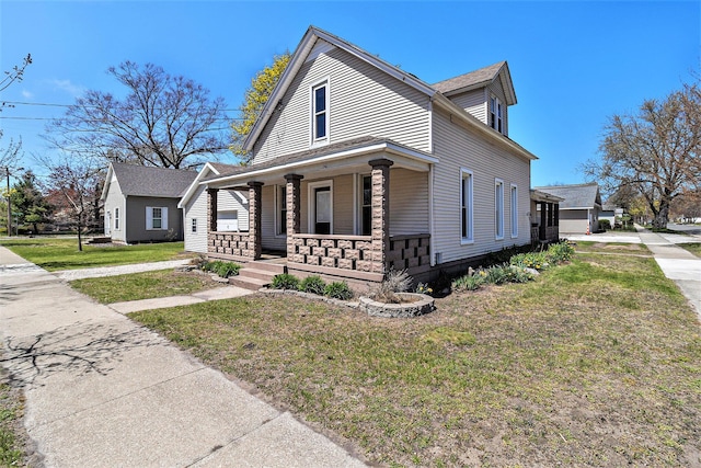 601 N Rath Ave, Ludington, MI 49431 - view of front of property with a porch and a front lawn