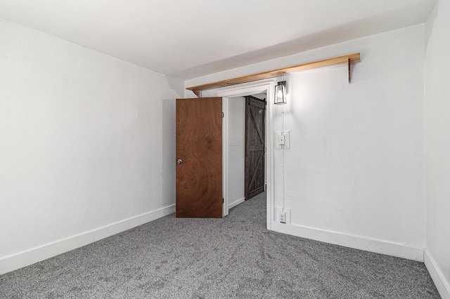 601 N Rath Ave, Ludington, MI 49431 - empty room with carpet and baseboards