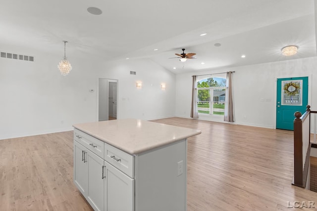 4189 Evergreen Rd, Adrian, MI 49221 - kitchen featuring lofted ceiling, a ceiling fan, open floor plan, light wood-type flooring, and recessed lighting
