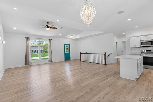 4189 Evergreen Rd, Adrian, MI 49221 - unfurnished living room with ceiling fan, recessed lighting, light wood-type flooring, a chandelier, and baseboards