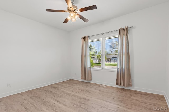 4189 Evergreen Rd, Adrian, MI 49221 - empty room featuring light wood-style flooring, baseboards, and ceiling fan