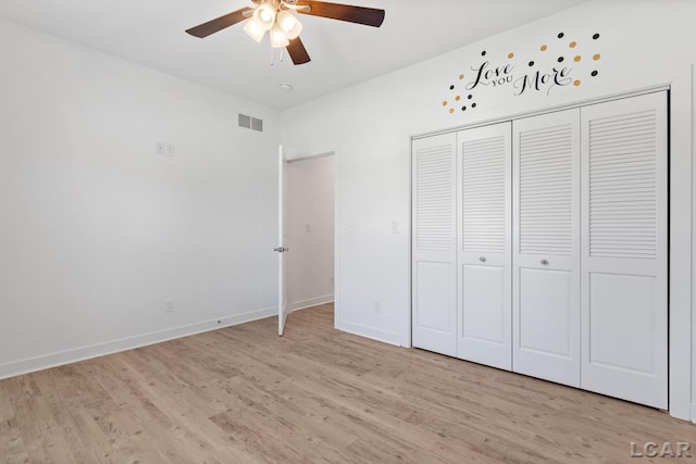 4189 Evergreen Rd, Adrian, MI 49221 - unfurnished bedroom with light wood-type flooring, baseboards, a closet, and a ceiling fan