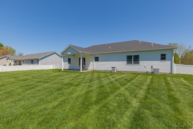 4189 Evergreen Rd, Adrian, MI 49221 - rear view of house with central AC unit and a patio