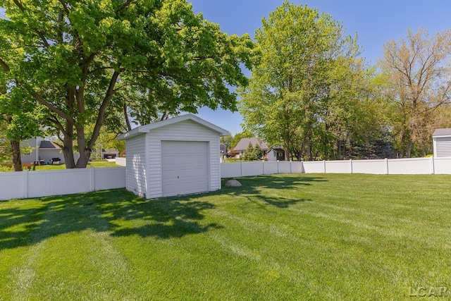 4189 Evergreen Rd, Adrian, MI 49221 - view of yard with an outdoor structure, a detached garage, and a storage unit