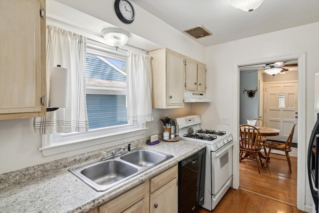 kitchen with white range with gas cooktop, under cabinet range hood, dishwasher, a sink, and light countertops