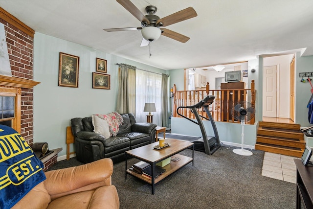 living room with ceiling fan, carpet floors, and baseboards