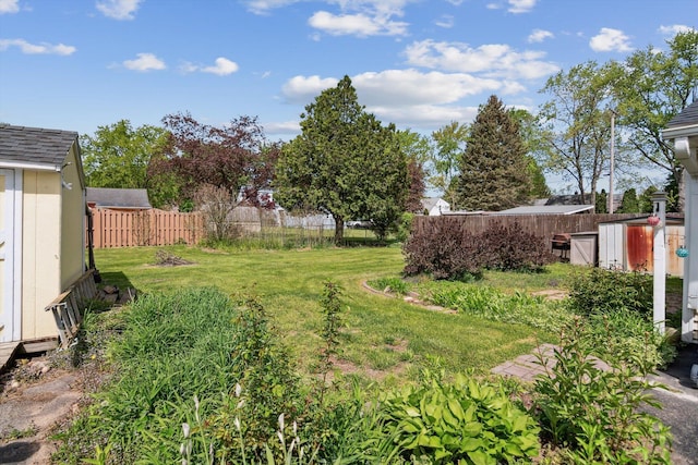 view of yard with an outbuilding and a shed