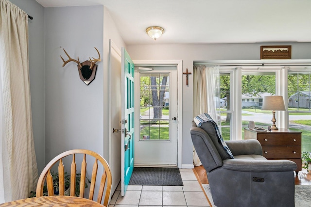 doorway featuring light tile patterned flooring