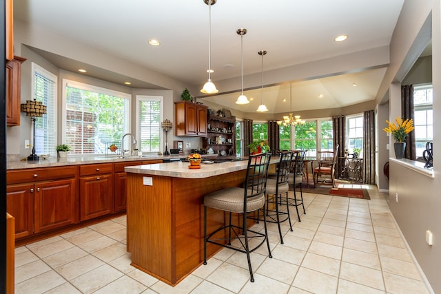 8216 Leonard Dr, Holly, MI 48442 - kitchen featuring a sink, light tile patterned floors, light countertops, healthy amount of natural light, and recessed lighting