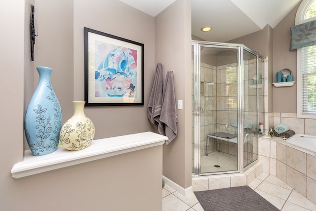 8216 Leonard Dr, Holly, MI 48442 - full bath featuring tile patterned flooring, a shower stall, a garden tub, baseboards, and lofted ceiling