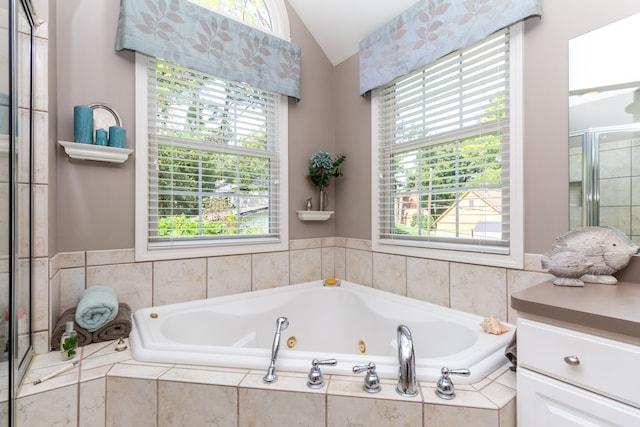 8216 Leonard Dr, Holly, MI 48442 - bathroom with lofted ceiling, healthy amount of natural light, a whirlpool tub, and a shower with door