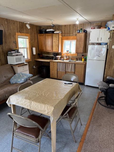 8038 W Hemlock Ave, Baldwin, MI 49304 - dining space with wooden walls