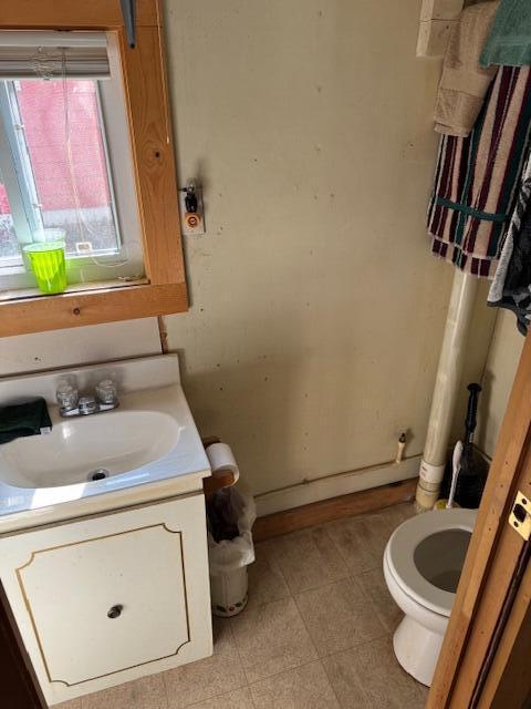 8038 W Hemlock Ave, Baldwin, MI 49304 - bathroom featuring vanity and toilet