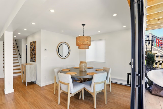 dining space with stairway, light wood-style flooring, recessed lighting, and baseboards