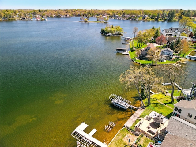aerial view of residential area featuring a large body of water