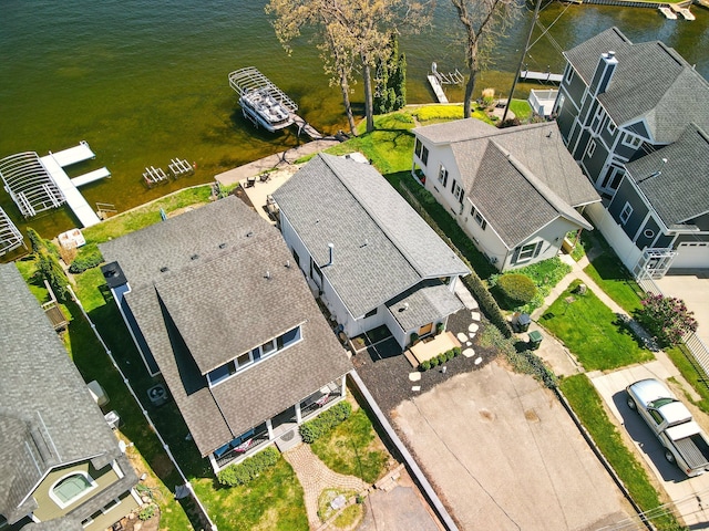 aerial perspective of suburban area featuring a large body of water