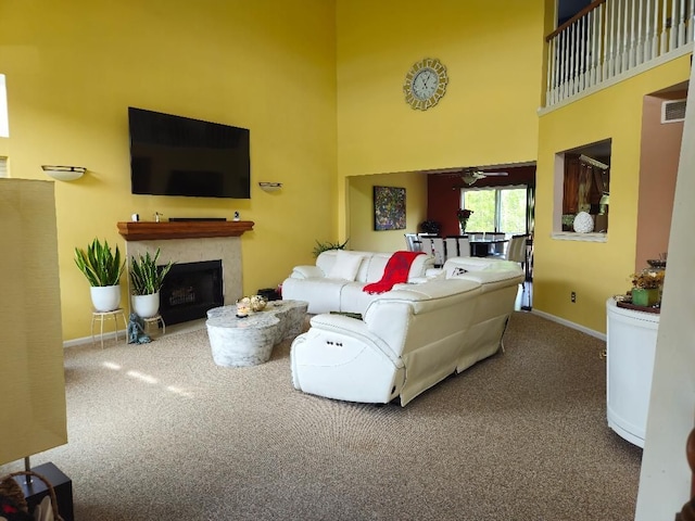 24864 Christina Dr, Flat Rock, MI 48134 - carpeted living area featuring a high ceiling, baseboards, and a fireplace