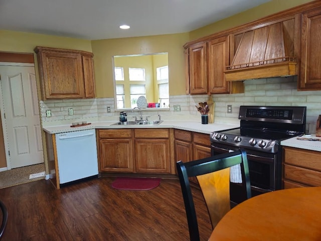 24864 Christina Dr, Flat Rock, MI 48134 - kitchen with dishwasher, electric range, a sink, premium range hood, and brown cabinets