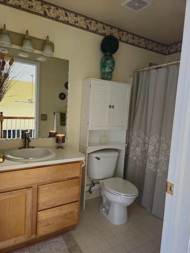 24864 Christina Dr, Flat Rock, MI 48134 - bathroom with tile patterned floors, toilet, and vanity