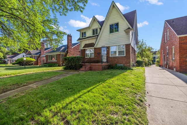13519 Mansfield St, Detroit, MI 48227 - view of front of house featuring brick siding, a front yard, and driveway