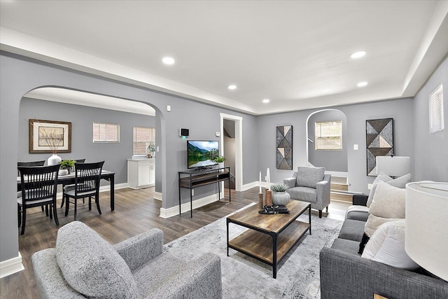 13519 Mansfield St, Detroit, MI 48227 - living area with arched walkways, baseboards, wood finished floors, and recessed lighting