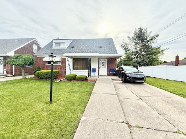 bungalow-style house featuring brick siding, driveway, and roof with shingles