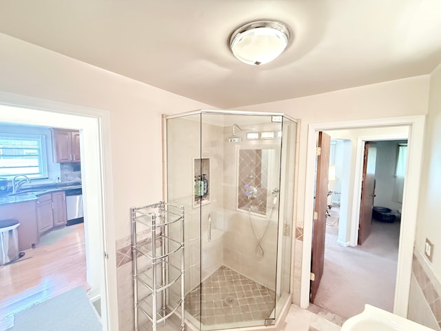 full bathroom with a sink and a stall shower