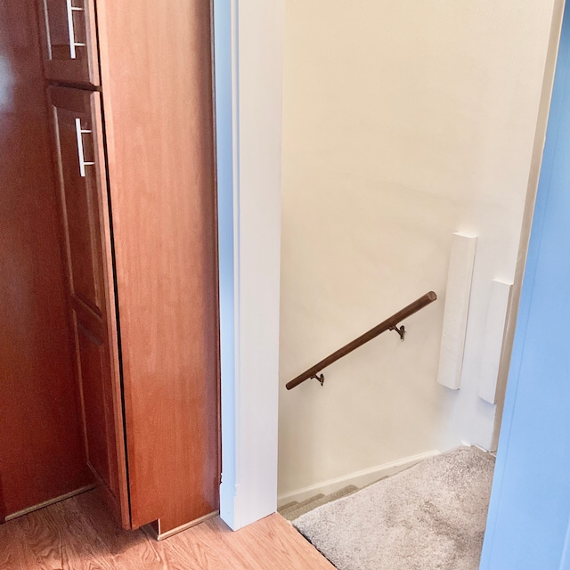 stairs with wood finished floors