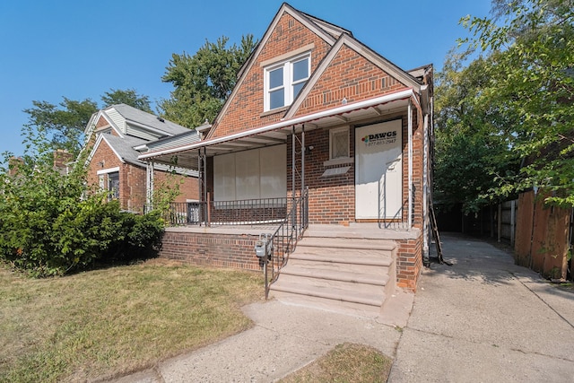 20410 Hull St, Highland Park, MI 48203 - view of front of house featuring brick siding and covered porch