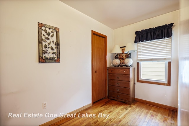 2505 Blake St, Saginaw, MI 48602 - bedroom featuring light wood-style flooring and baseboards