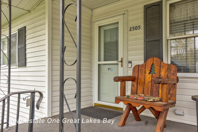 2505 Blake St, Saginaw, MI 48602 - view of exterior entry with a porch
