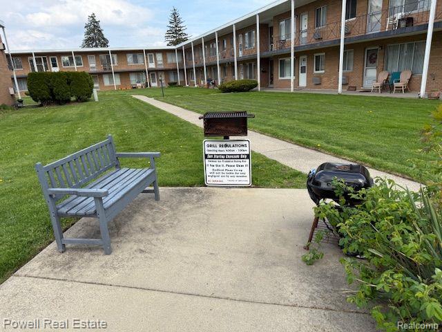 17121 Redford St Unit 212, Detroit, MI 48219 - view of community featuring a yard