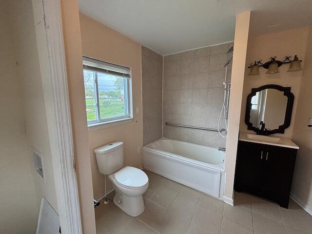 4770 Matthew St, Westland, MI 48186 - full bathroom with toilet, tile patterned floors, vanity, shower / bathtub combination, and baseboards