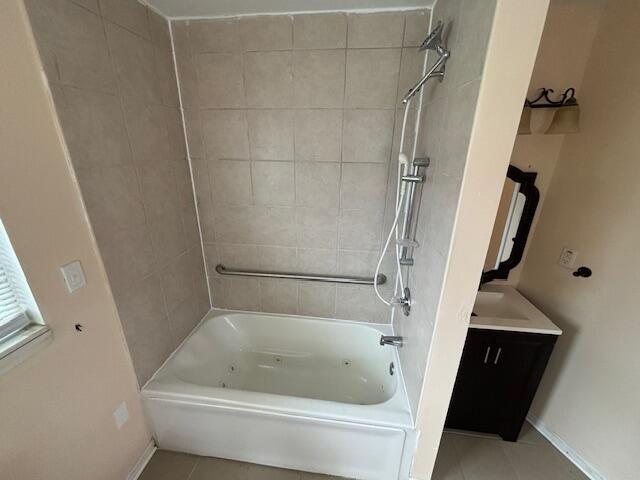 4770 Matthew St, Westland, MI 48186 - full bathroom featuring tile patterned flooring, shower / washtub combination, and baseboards