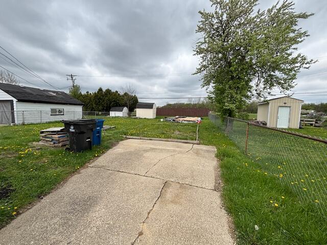 4770 Matthew St, Westland, MI 48186 - view of patio / terrace with a storage shed and an outbuilding