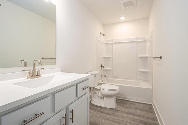 15250 Alister Mackenzie Ave, Augusta, MI 49012 - full bath with wood finished floors, vanity, toilet, and shower / bathtub combination