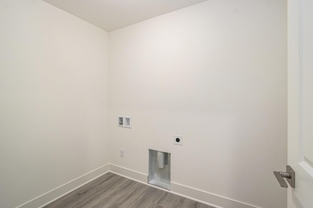 15250 Alister Mackenzie Ave, Augusta, MI 49012 - clothes washing area with dark wood-type flooring, baseboards, electric dryer hookup, and washer hookup