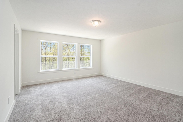 15250 Alister Mackenzie Ave, Augusta, MI 49012 - unfurnished room with baseboards and light carpet