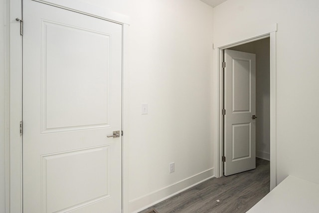 15250 Alister Mackenzie Ave, Augusta, MI 49012 - corridor featuring dark wood finished floors and baseboards
