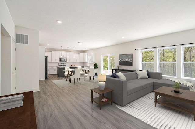 15250 Alister Mackenzie Ave, Augusta, MI 49012 - living room featuring wood finished floors and recessed lighting